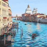 canal in venice with punters and historic buildings