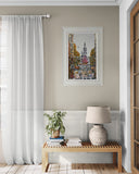 Living room with a wooden bench, lamp, and framed artwork on a beige wall.