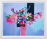 A colorful floral artwork framed featuring vibrant pink and blue flowers arranged in a striped vase against a light blue background.