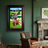 Framed artwork of a golfing scene on a green wall with a brown armchair and stone fireplace.