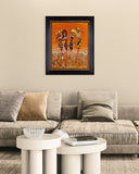 Framed artwork on a wall above a sofa in a living room