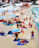A colourful beach scene artwork showing a sandy shore with people, striped umbrellas, towels, and blue ocean water. The image has a painterly, impressionistic style rather than a photographic product shot.