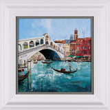 framed cityscape artwork of venice water with boat and buildings surrounding.