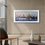 Framed cityscape painting on a wall in a modern living room.