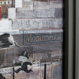 cityscape artwork with text 'Monumental' and figure of Mr. Monopoly
