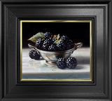 Framed artwork of blackberries in a silver bowl on a dark background