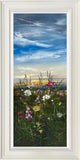 Framed artwork of a field with flowers and a blue sky.