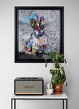 Framed colorful artwork of a dog with 'LOVE' on a wall above a Marshall speaker and plant.