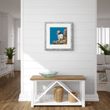 A framed art print of a puffin in room