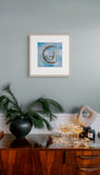 Gary Waltons Frosty Morning hanging above festive drinks 
