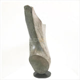 An abstract sculptural bronze sculpture of torso