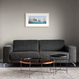 A framed horizontal art print depicting colorful fishing boats on the water room