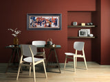 kitchen tango a colorful geometric design hangs on a dark red wall above a dining table with chairs in a modern dining room setting.
