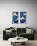 A pair of vertical framed abstract paintings with deep blue backgrounds and 