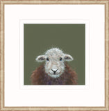 A framed art print featuring a close-up illustration of a sheep's face and fluffy brown wool against a muted olive green background, set within a white mat and a light wood frame.