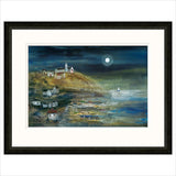 Framed artwork of a coastal scene with houses and a moonlit sky.