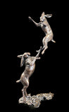 Bronze Sculpture featuring small hares engaged in a boxing match
