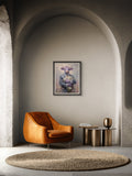 A framed art print of a cow in a suit hanging on a gray arched wall