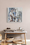 A framed abstract horse painting in muted blue, gray, white, and brown tones